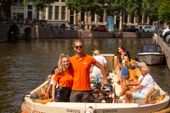 a group of people riding on the back of a boat
