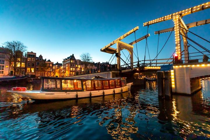 a boat is docked next to a body of water